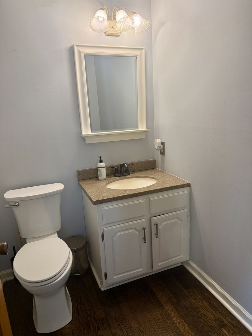 10151 East Hickory Ridge Drive Rochelle, IL 61068 - Photo 6 of 31 a bathroom with a toilet sink and mirror