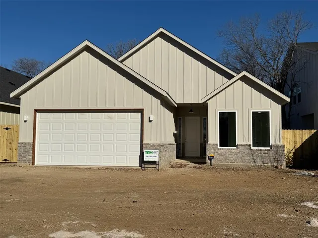 a view of a house with a garage