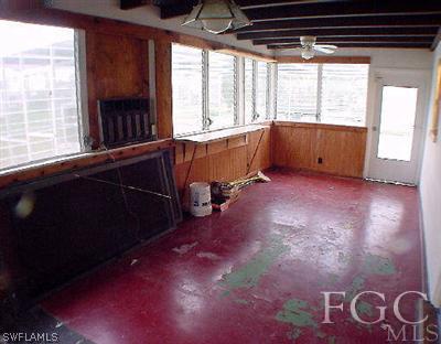 107 Texas Road, Unit 20 Lehigh Acres, FL 33936 - Photo 3 of 6 a view of an empty room with a window