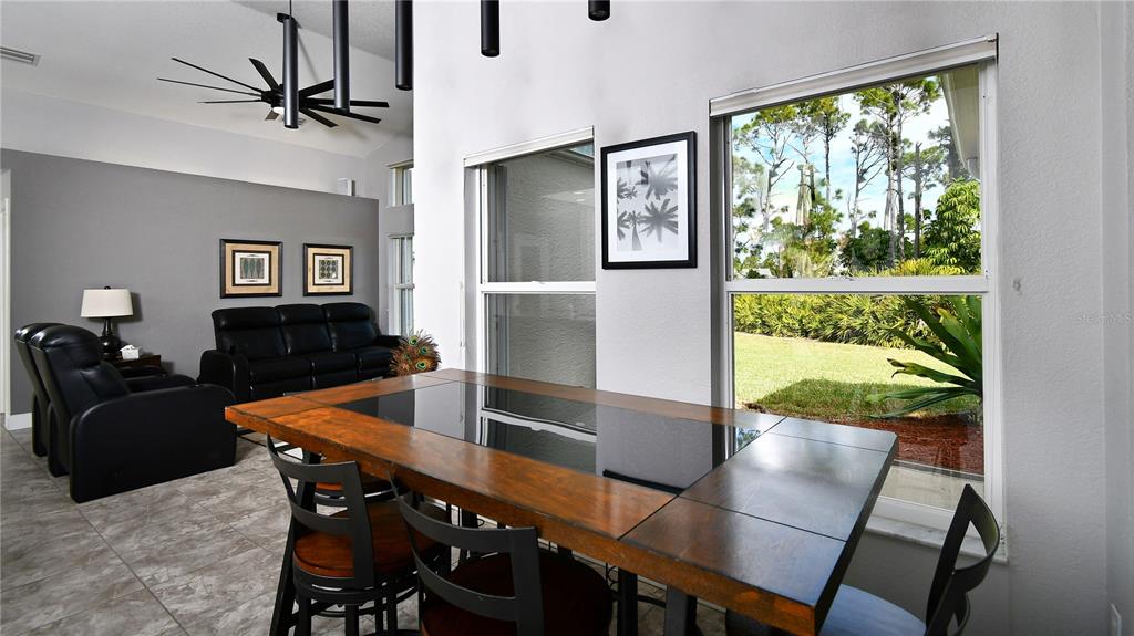 5010 Sable Key Circle Punta Gorda, FL 33955 - Photo 22 of 41 a view of a dining room with furniture window and wooden floor