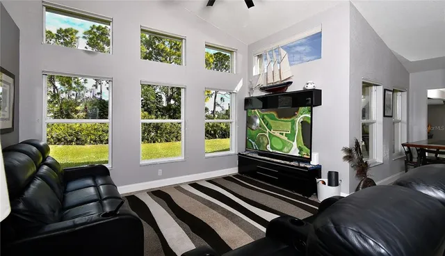 a living room with furniture and a window