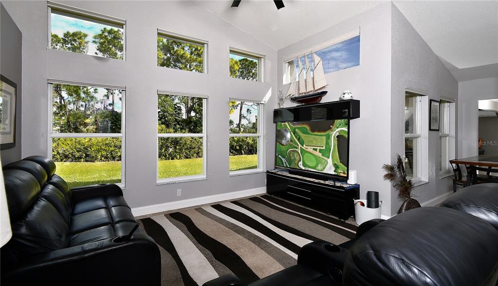 5010 Sable Key Circle Punta Gorda, FL 33955 - Photo 23 of 41 a living room with furniture and a flat screen tv