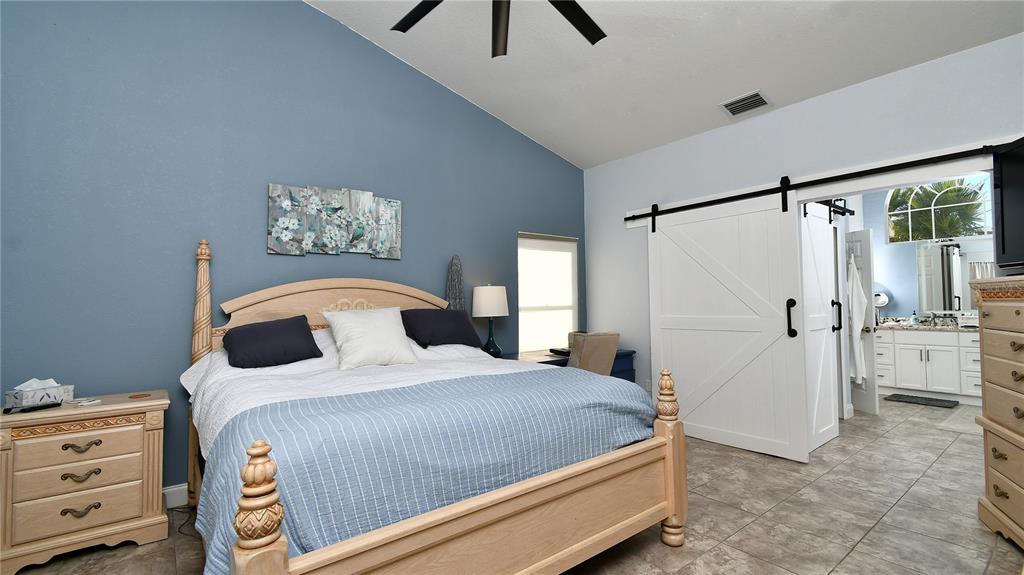 5010 Sable Key Circle Punta Gorda, FL 33955 - Photo 26 of 41 a bedroom with a bed and a window