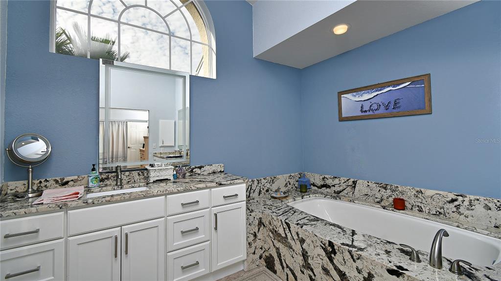 5010 Sable Key Circle Punta Gorda, FL 33955 - Photo 28 of 41 a bathroom with a sink and a mirror