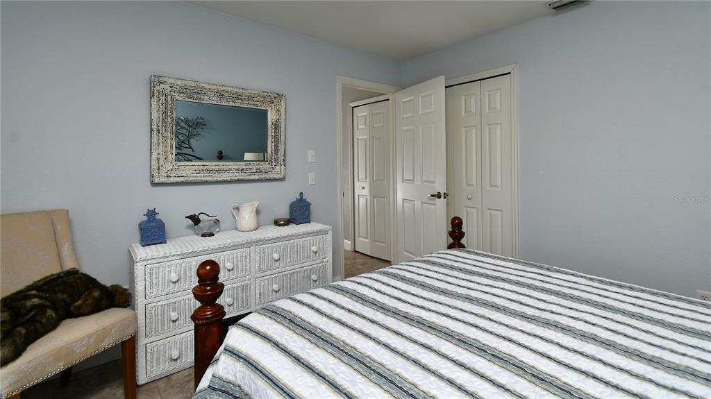 5010 Sable Key Circle Punta Gorda, FL 33955 - Photo 32 of 41 a bedroom with a bed and a dresser