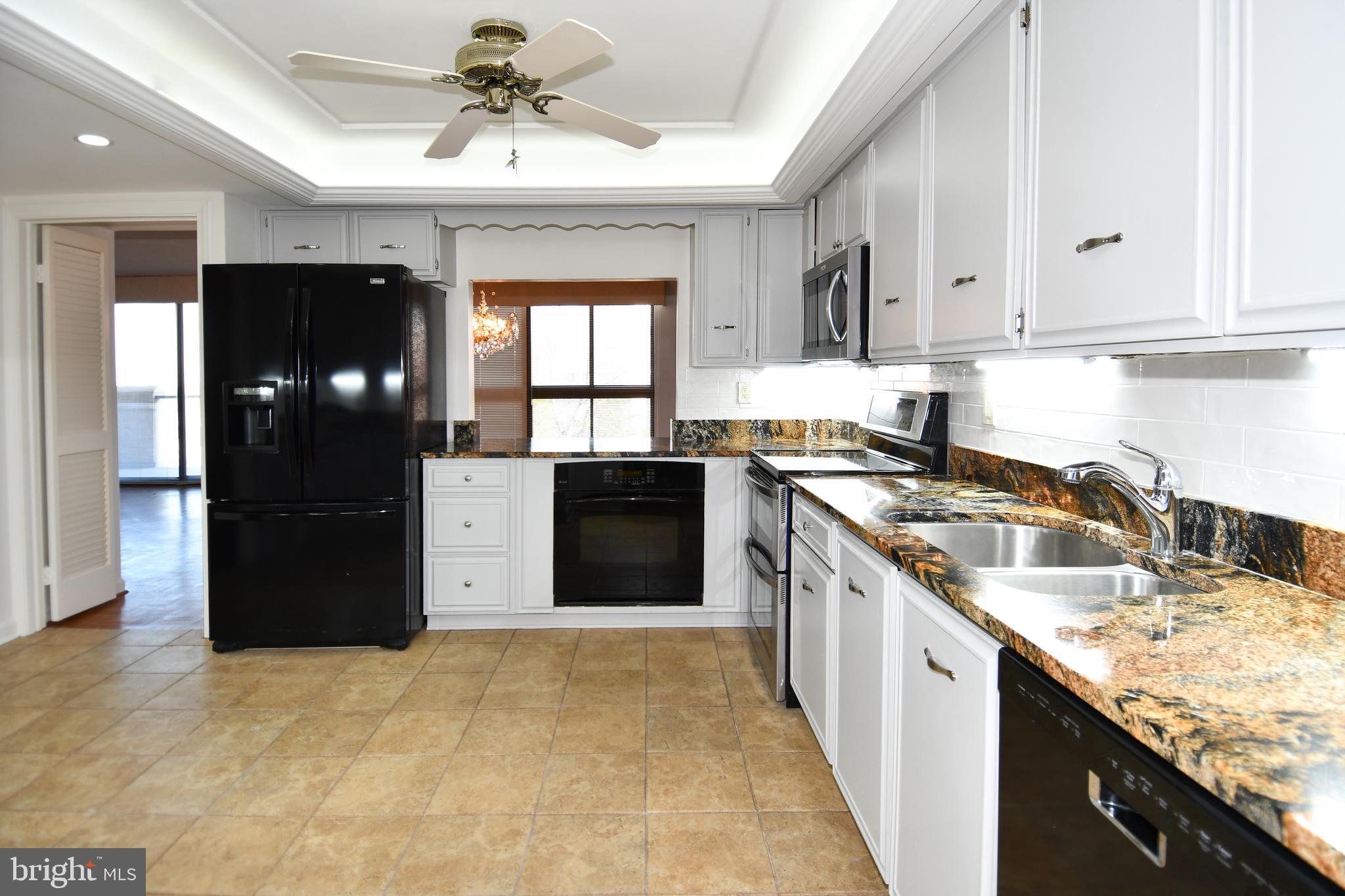 1101 South Arlington Ridge Road, Unit 316 Arlington, VA 22202 - Photo 22 of 75 Opening to dining room from kitchen
