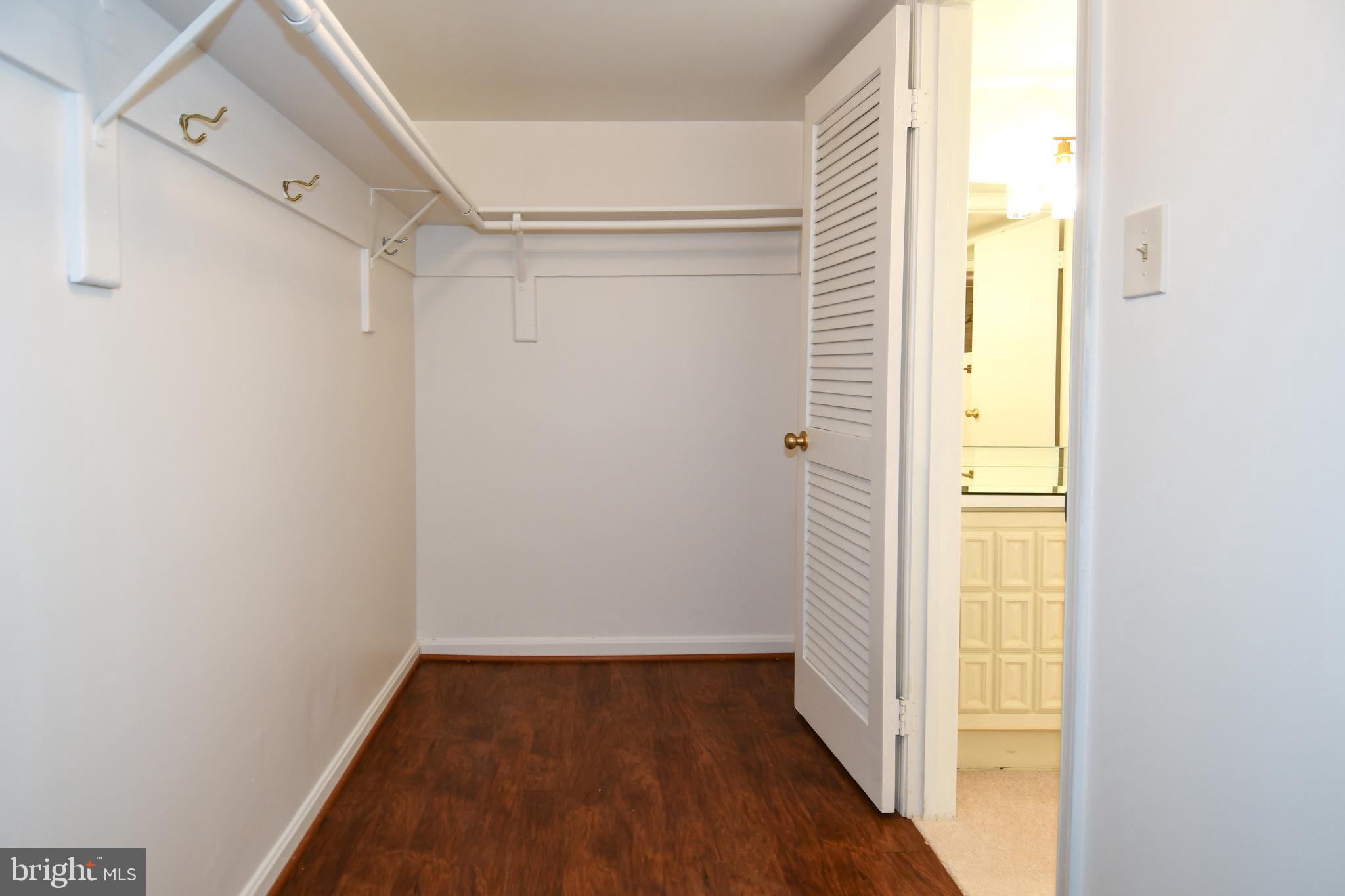 1101 South Arlington Ridge Road, Unit 316 Arlington, VA 22202 - Photo 43 of 75 a view of a hallway with wooden floor and a window
