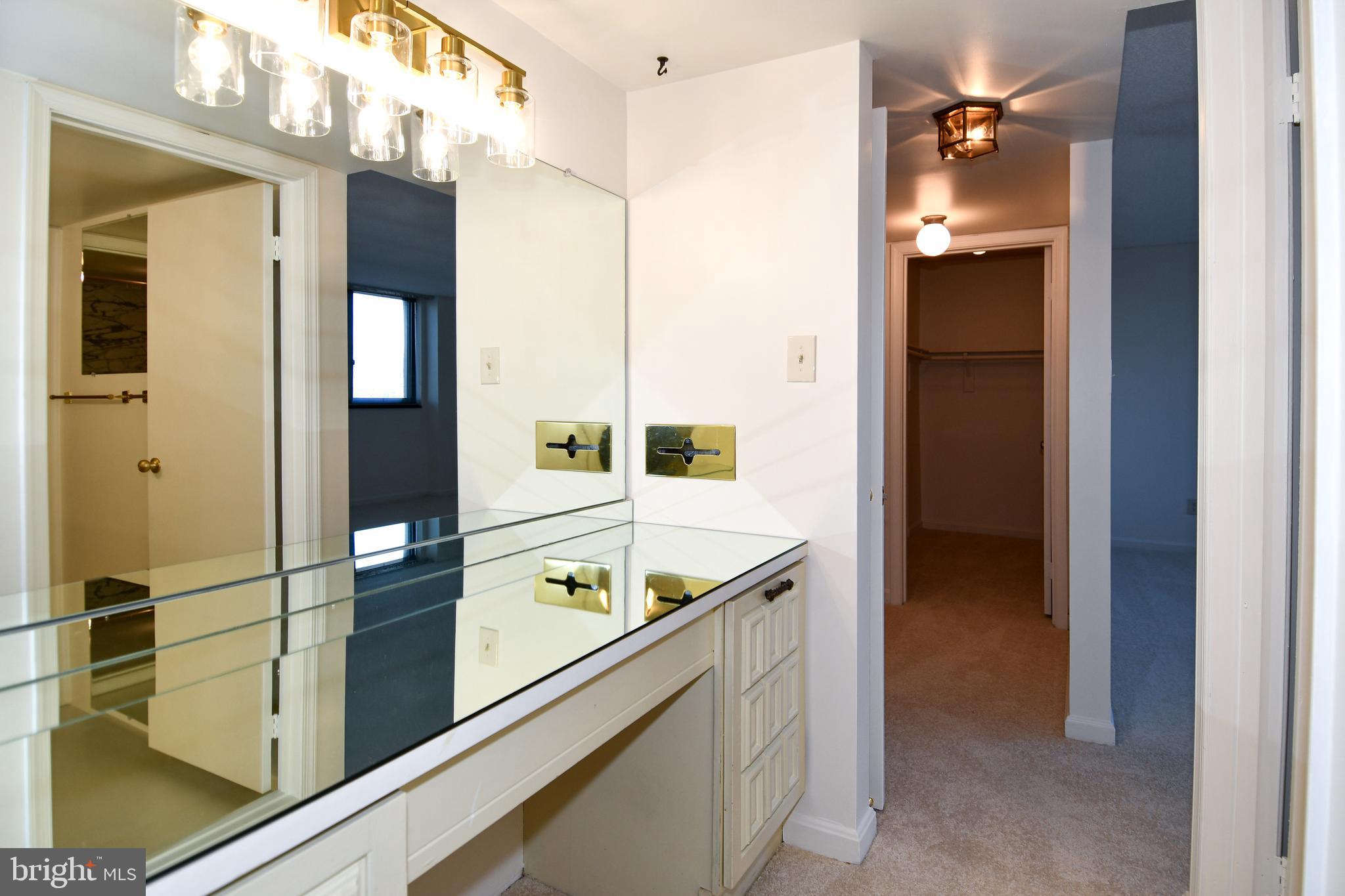 1101 South Arlington Ridge Road, Unit 316 Arlington, VA 22202 - Photo 44 of 75 Master dressing area with second walk in closet