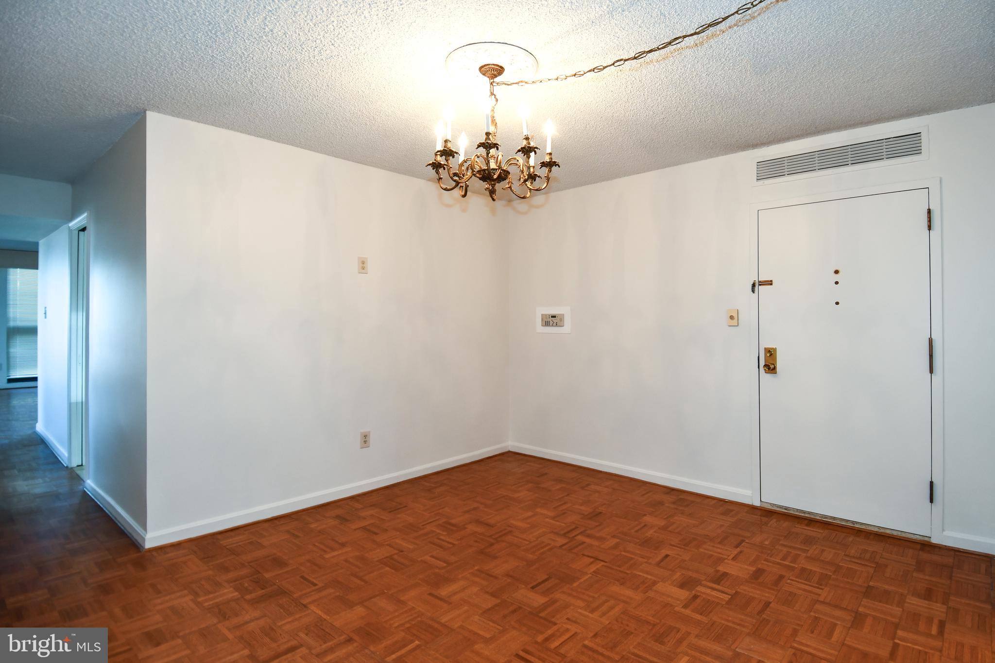 1101 South Arlington Ridge Road, Unit 316 Arlington, VA 22202 - Photo 6 of 75 a view of a chandelier in an empty room