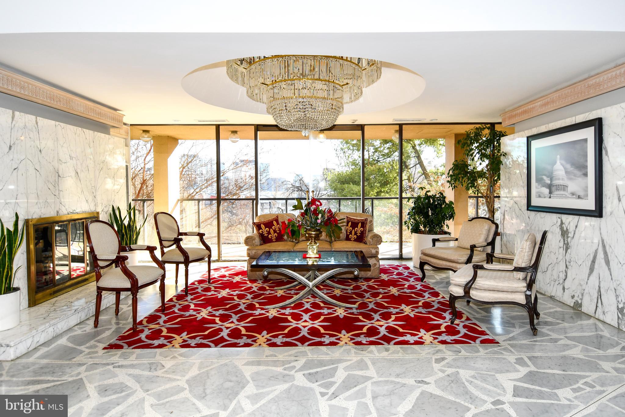 1101 South Arlington Ridge Road, Unit 316 Arlington, VA 22202 - Photo 63 of 75 a living room with patio furniture and a floor to ceiling window