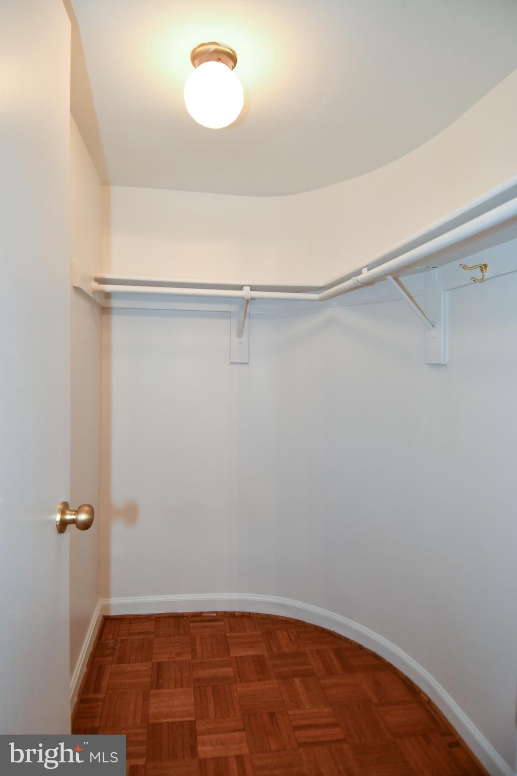 1101 South Arlington Ridge Road, Unit 316 Arlington, VA 22202 - Photo 9 of 75 a view of a room with racks on the wall