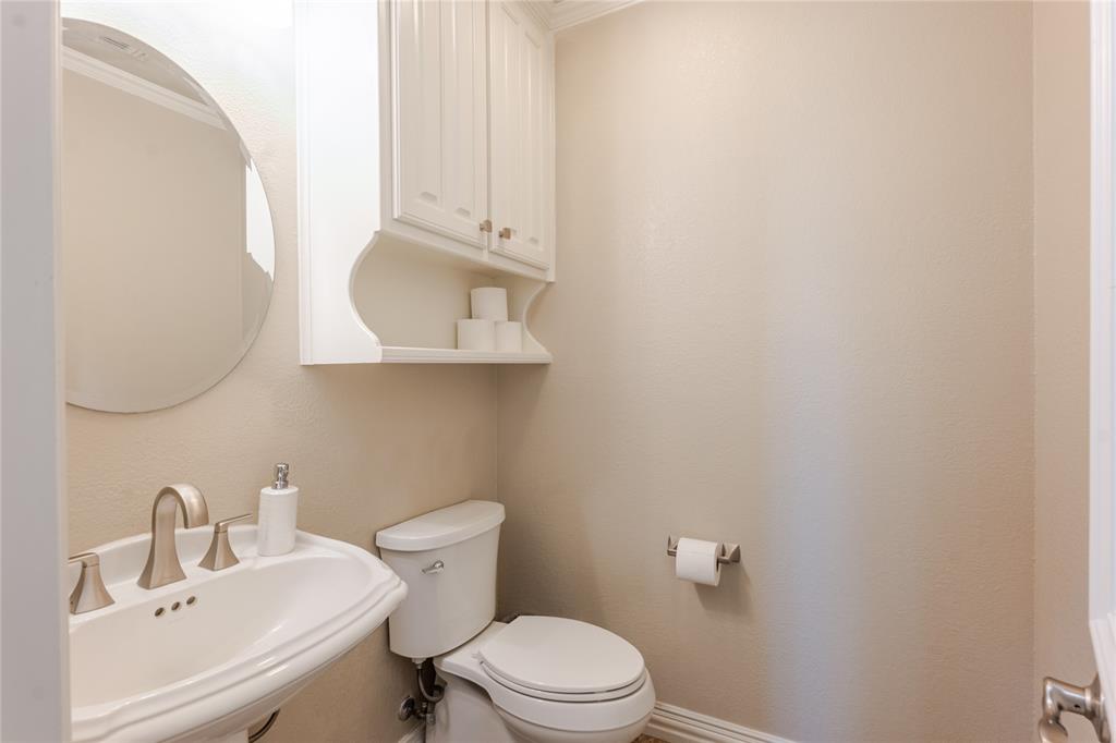 166 East Rio Ridge Azle, TX 76020 - Photo 34 of 40 a bathroom with a sink a toilet and vanity
