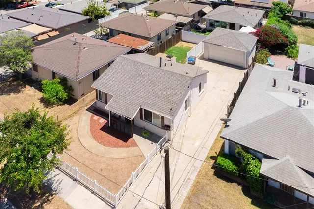 an aerial view of a house with swimming pool and outdoor space