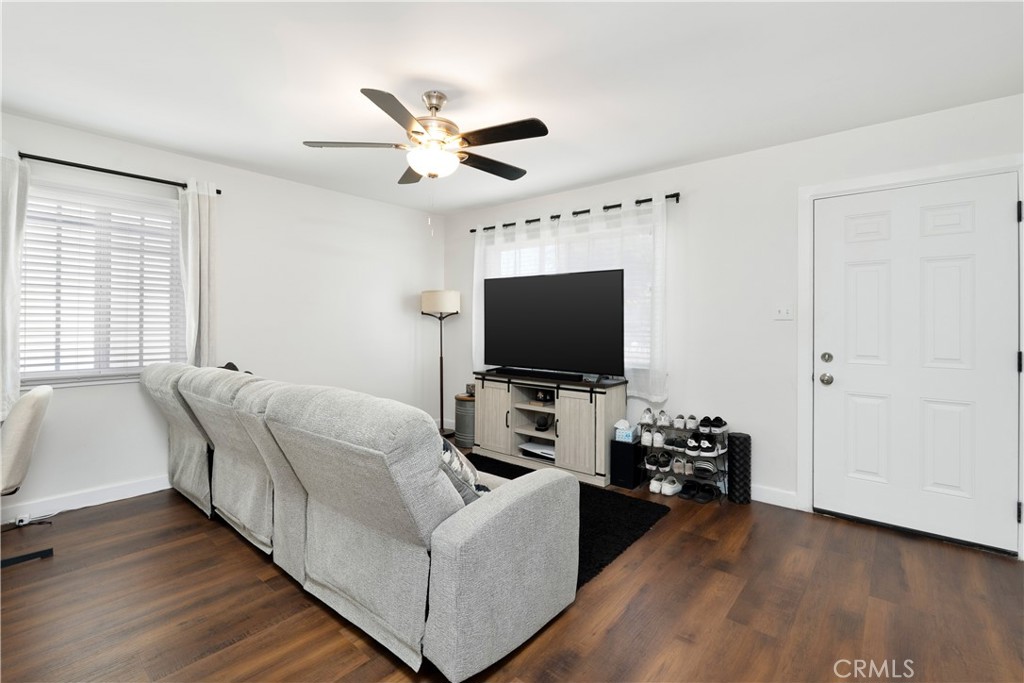 4712 West 152nd Street Lawndale, CA 90260 - Photo 13 of 21 a living room with furniture and a flat screen tv