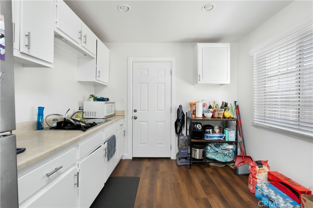 4712 West 152nd Street Lawndale, CA 90260 - Photo 17 of 21 a kitchen with a sink cabinets and wooden floor