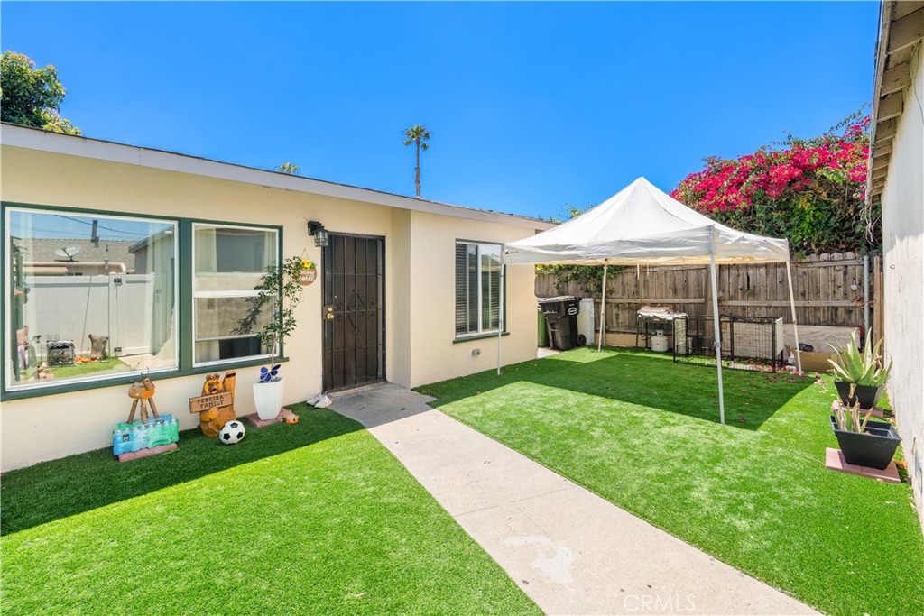 4712 West 152nd Street Lawndale, CA 90260 - Photo 4 of 21 a view of a house with backyard and garden