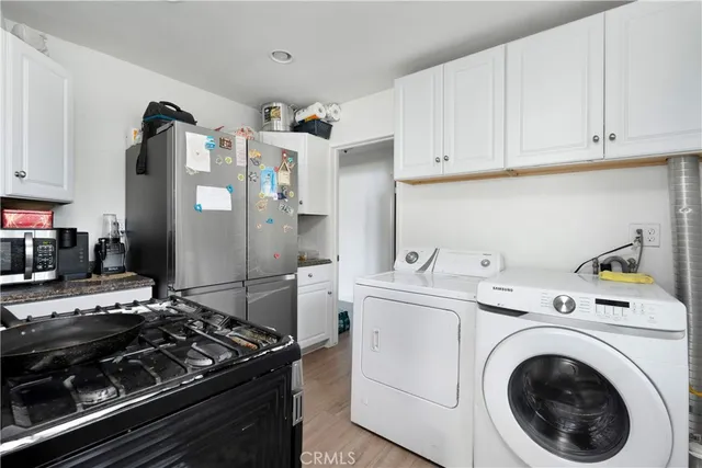 a kitchen with a stove and a refrigerator
