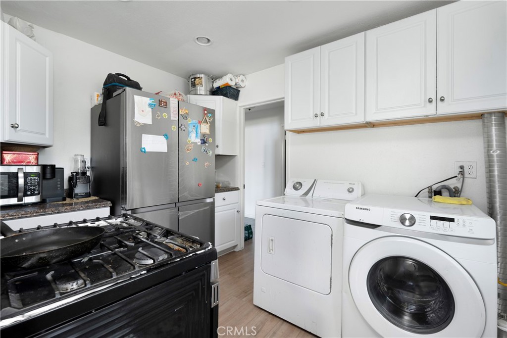 4712 West 152nd Street Lawndale, CA 90260 - Photo 6 of 21 a kitchen with a stove and a refrigerator