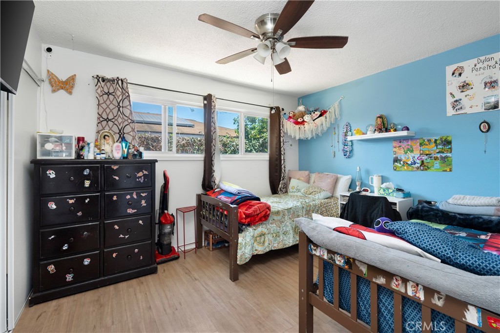 4712 West 152nd Street Lawndale, CA 90260 - Photo 7 of 21 a bedroom with furniture and a large window