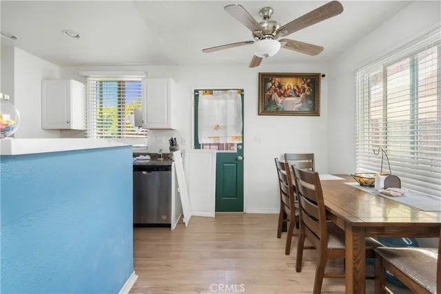 a dining room with furniture and window
