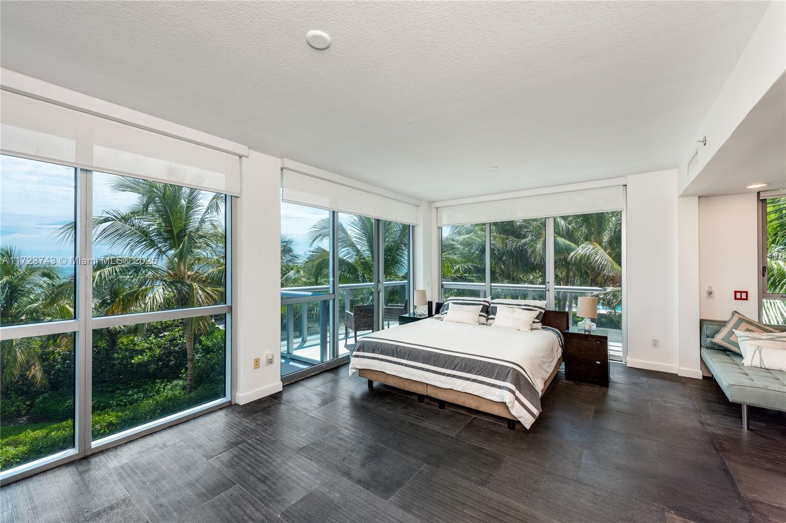 3801 Collins Avenue, Unit TH4 Miami Beach, FL 33140 - Photo 7 of 19 a room with a bed and a large window