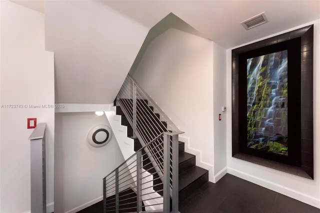 a view of entryway and hall with a door