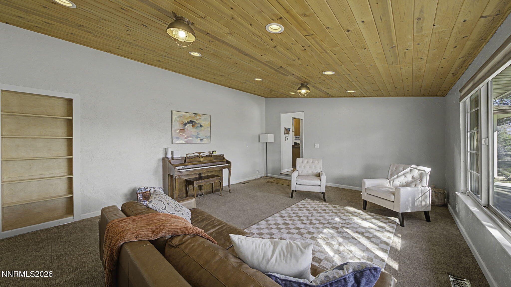 10585 Silver Knolls Boulevard Reno, NV 89508 - Photo 13 of 50 a bedroom with furniture and a chandelier