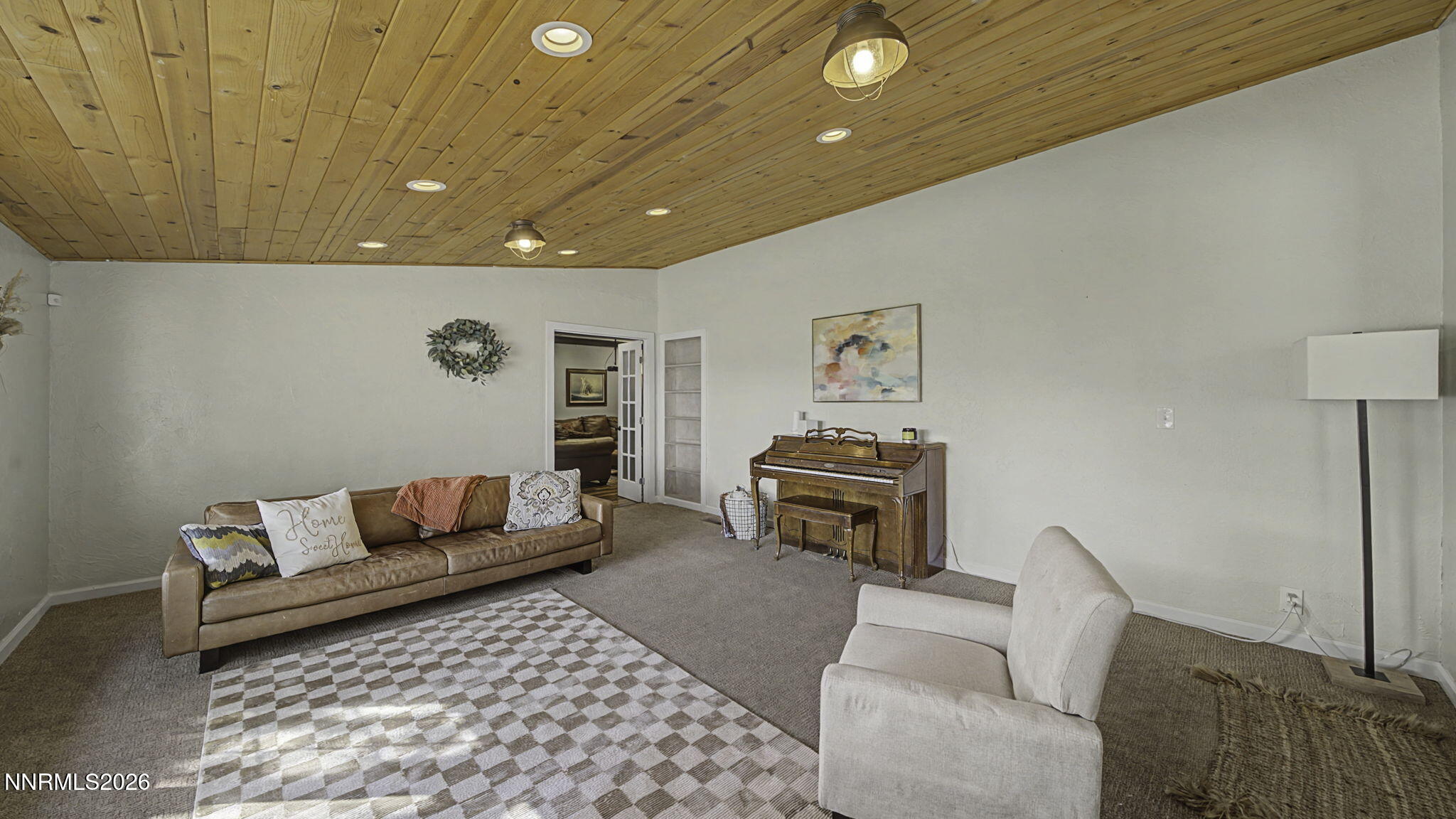 10585 Silver Knolls Boulevard Reno, NV 89508 - Photo 14 of 50 a living room with furniture a couch and a coffee table