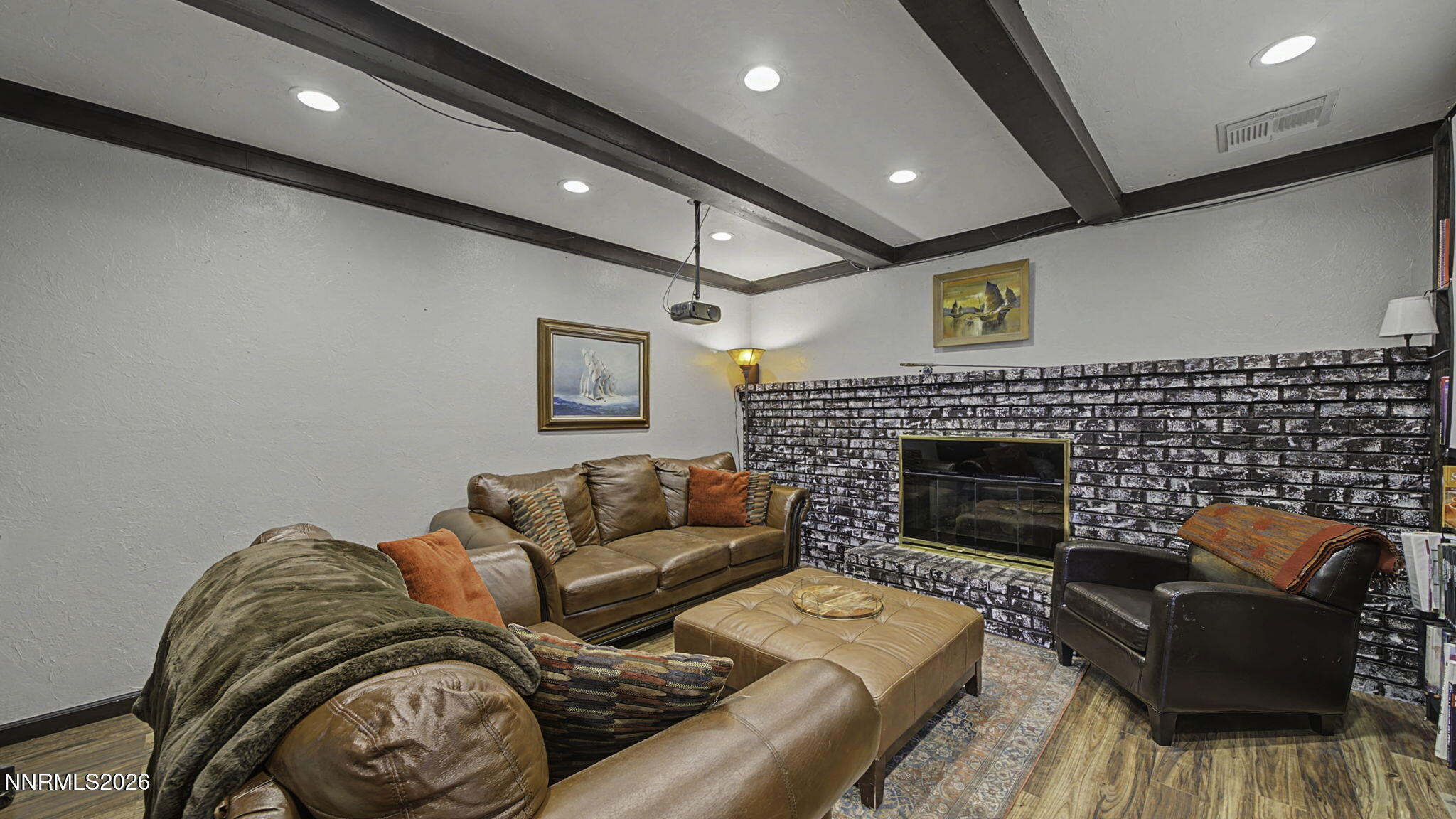 10585 Silver Knolls Boulevard Reno, NV 89508 - Photo 16 of 50 a living room with furniture and a fireplace