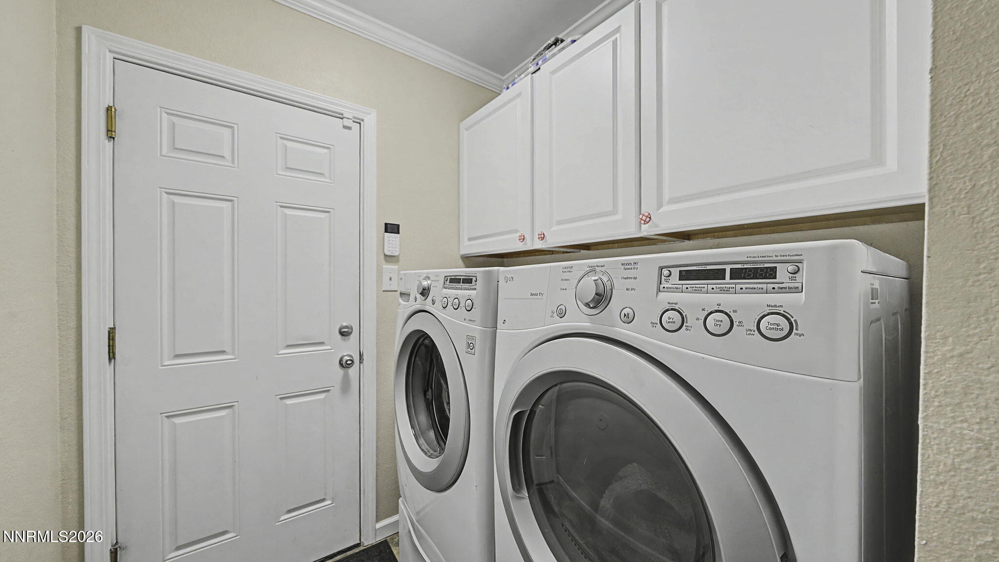 10585 Silver Knolls Boulevard Reno, NV 89508 - Photo 17 of 50 a utility room with dryer and washer