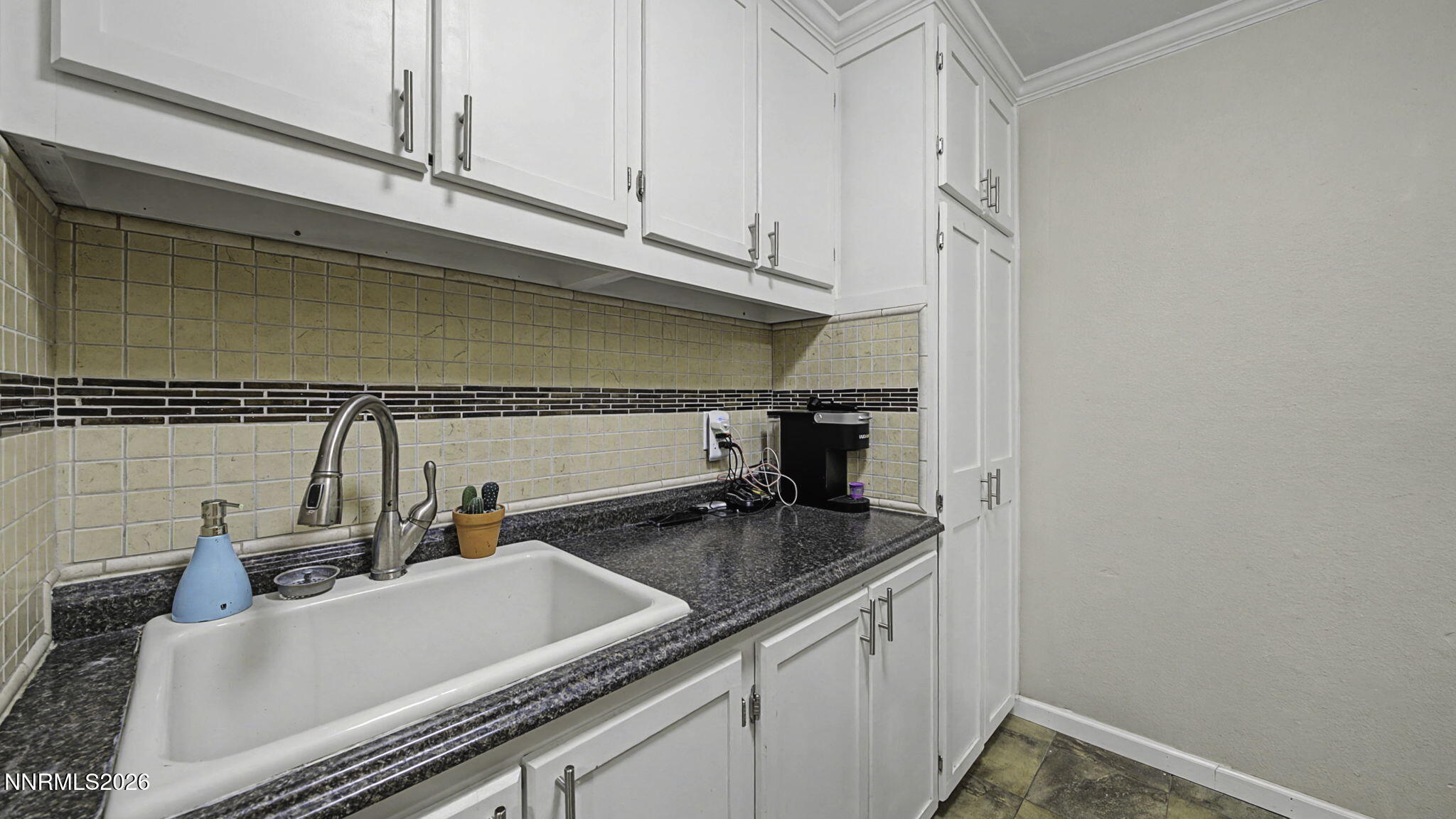 10585 Silver Knolls Boulevard Reno, NV 89508 - Photo 18 of 50 a kitchen with a sink and cabinets