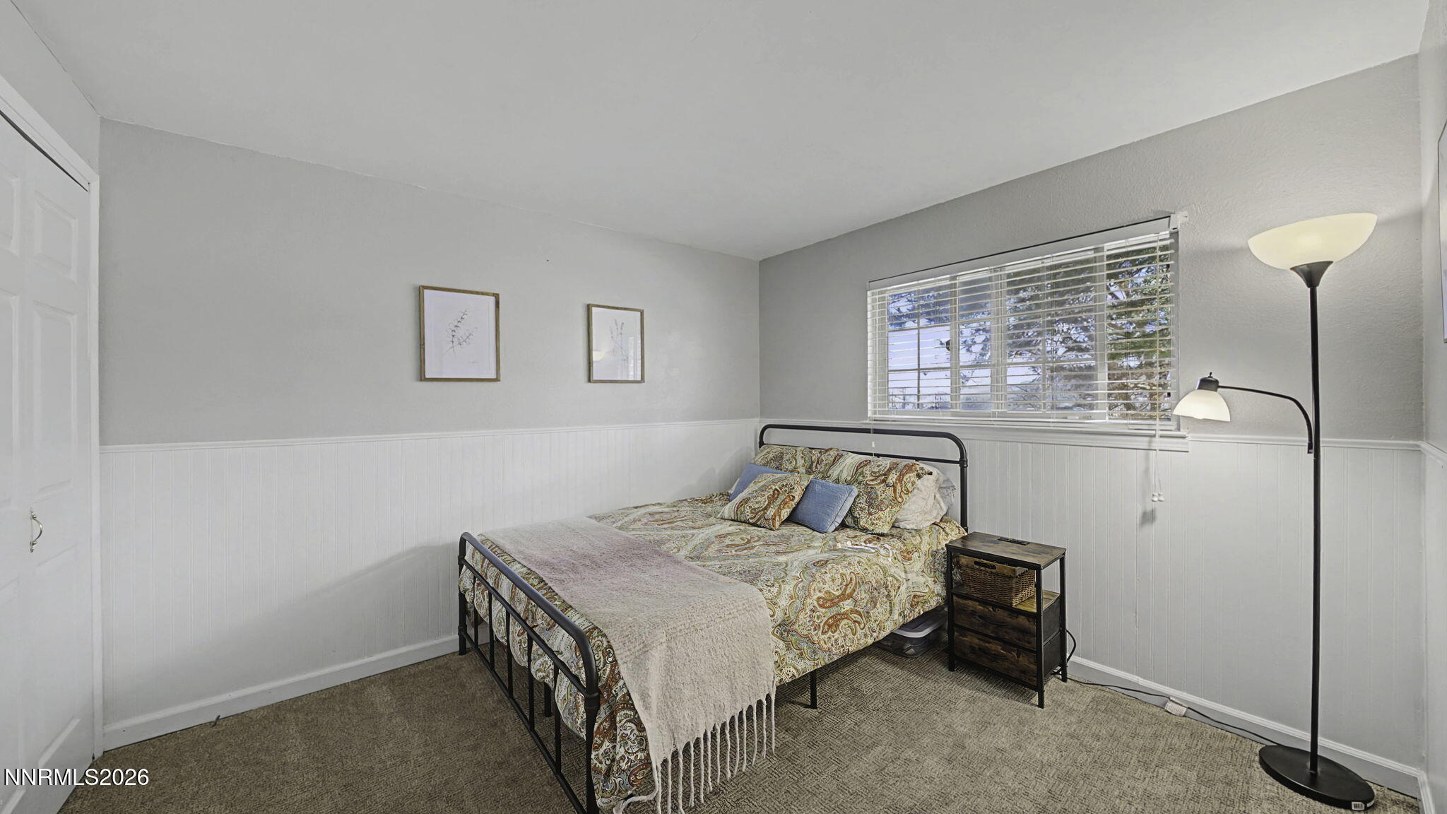 10585 Silver Knolls Boulevard Reno, NV 89508 - Photo 30 of 50 a bedroom with a bed and a window