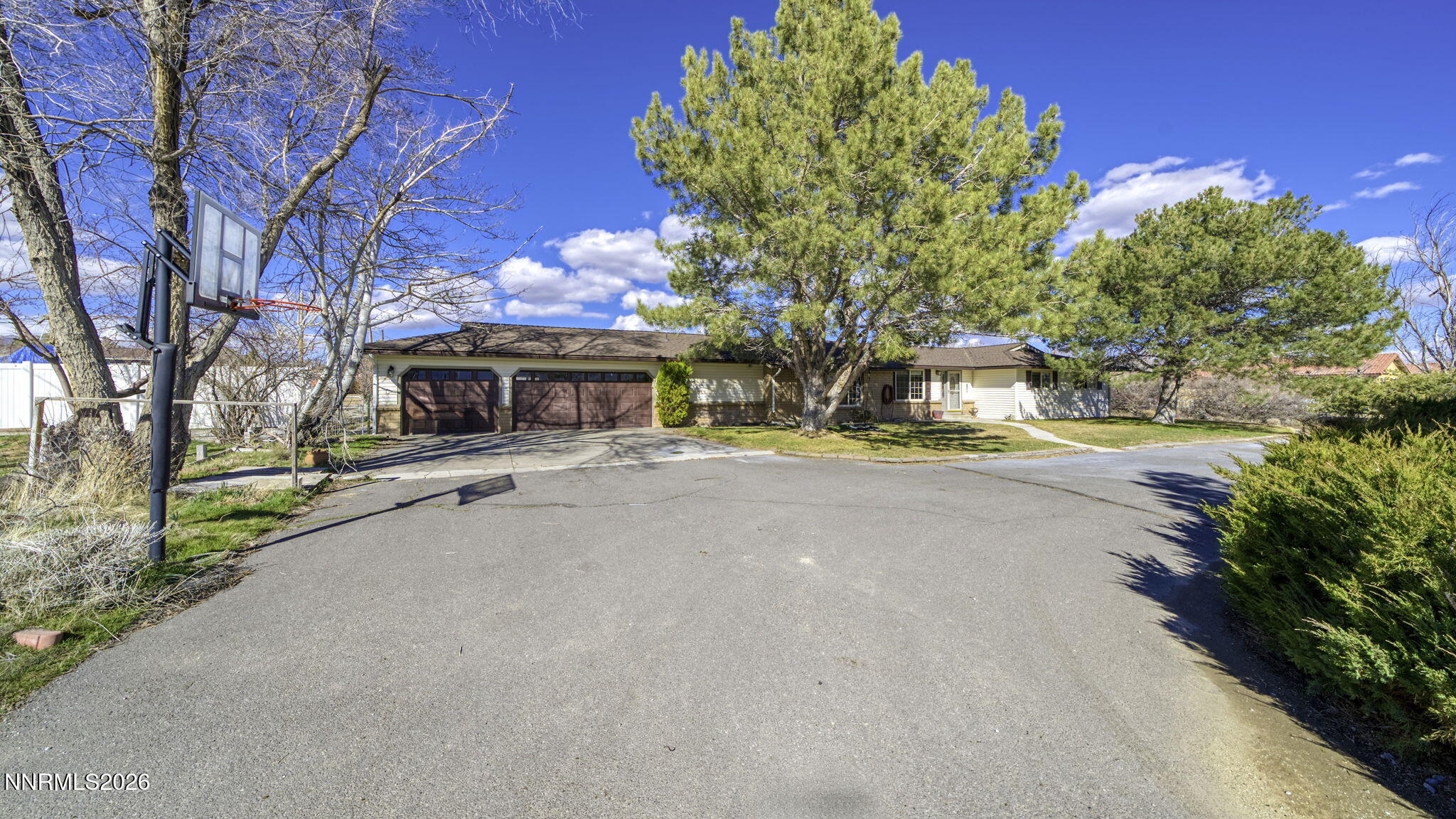 10585 Silver Knolls Boulevard Reno, NV 89508 - Photo 33 of 50 a view of a house with large trees and plants