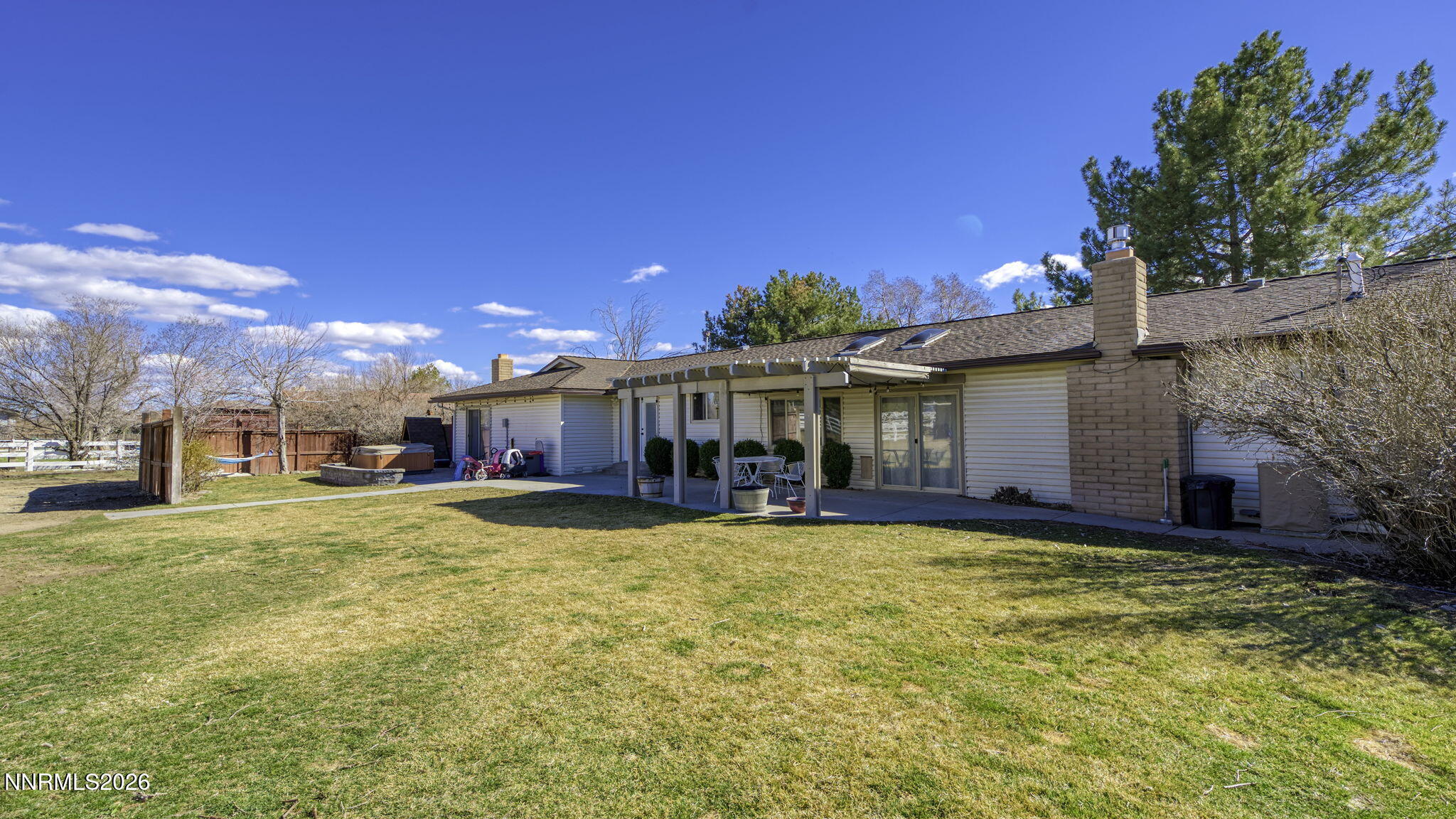 10585 Silver Knolls Boulevard Reno, NV 89508 - Photo 37 of 50 a view of a house with a big yard and large trees