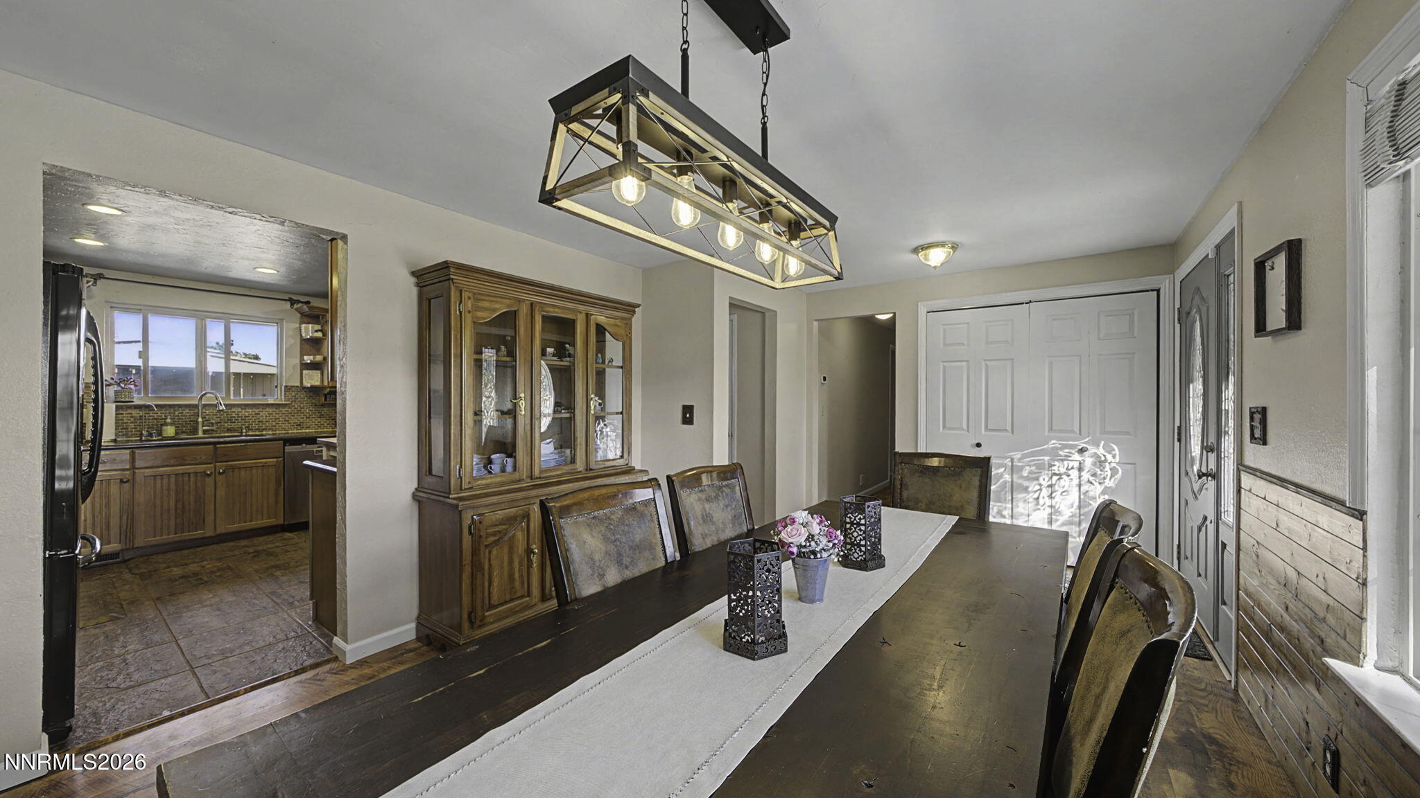 10585 Silver Knolls Boulevard Reno, NV 89508 - Photo 4 of 50 a view of a dining room with furniture window and wooden floor