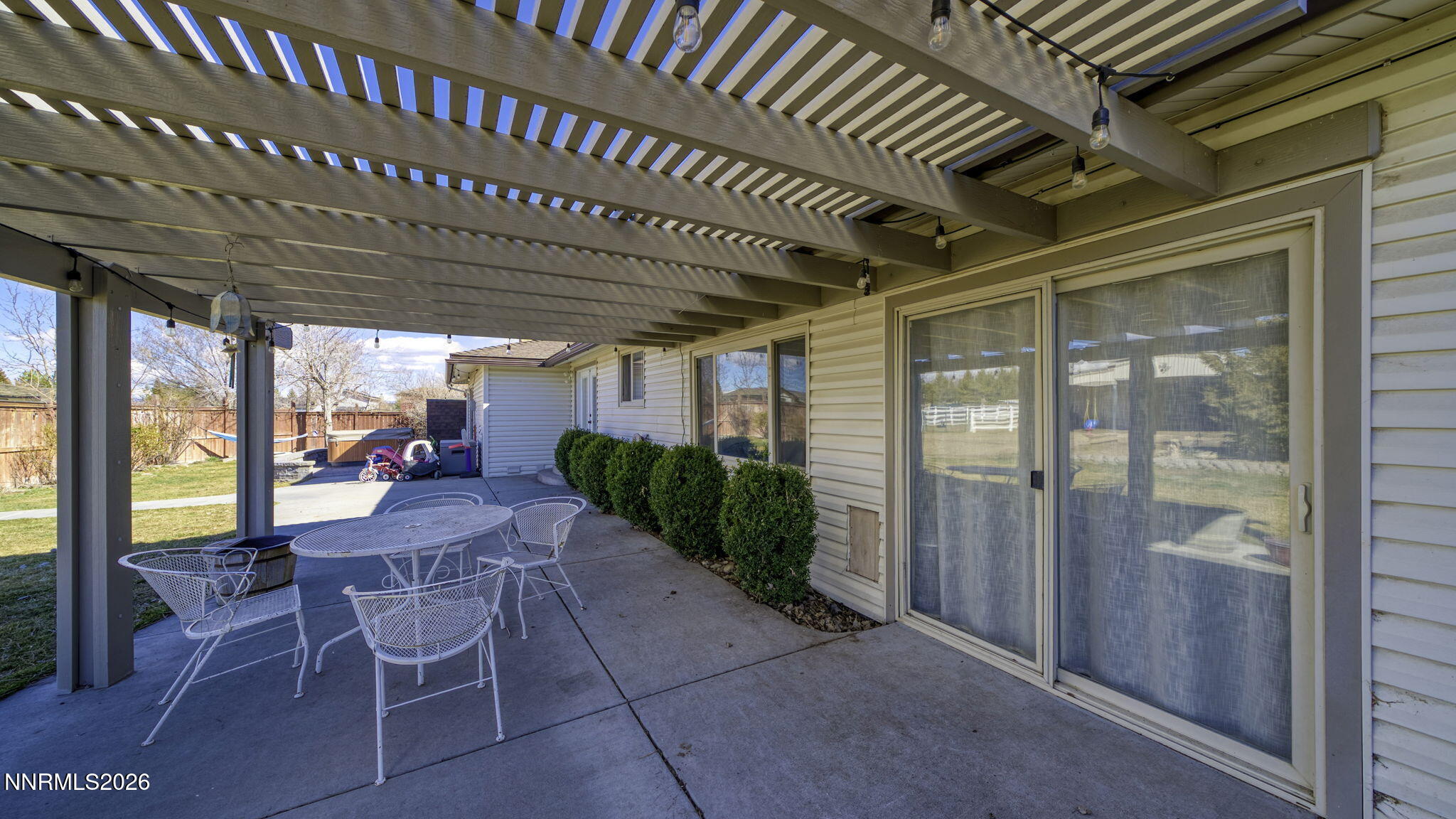 10585 Silver Knolls Boulevard Reno, NV 89508 - Photo 41 of 50 a view of a porch with furniture and yard