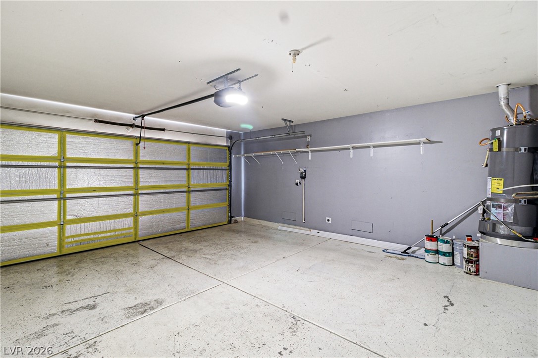 9523 Observer Street Las Vegas, NV 89123 - Photo 33 of 42 A spacious garage with a functional garage door opener and ample storage possibilities.