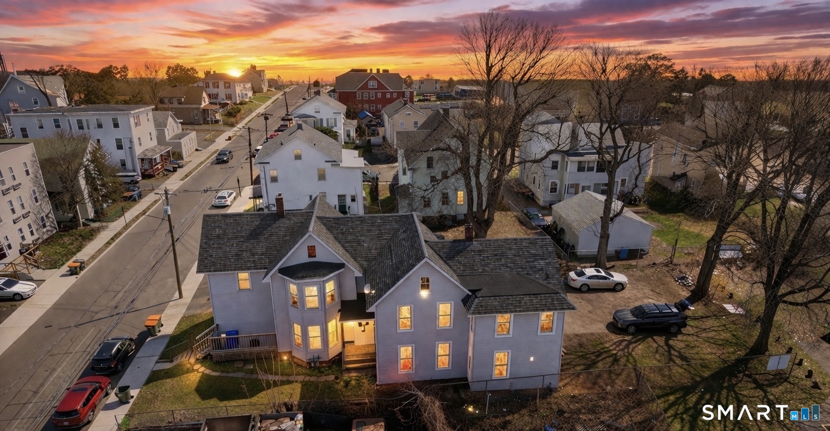 a view of multiple houses with a city street