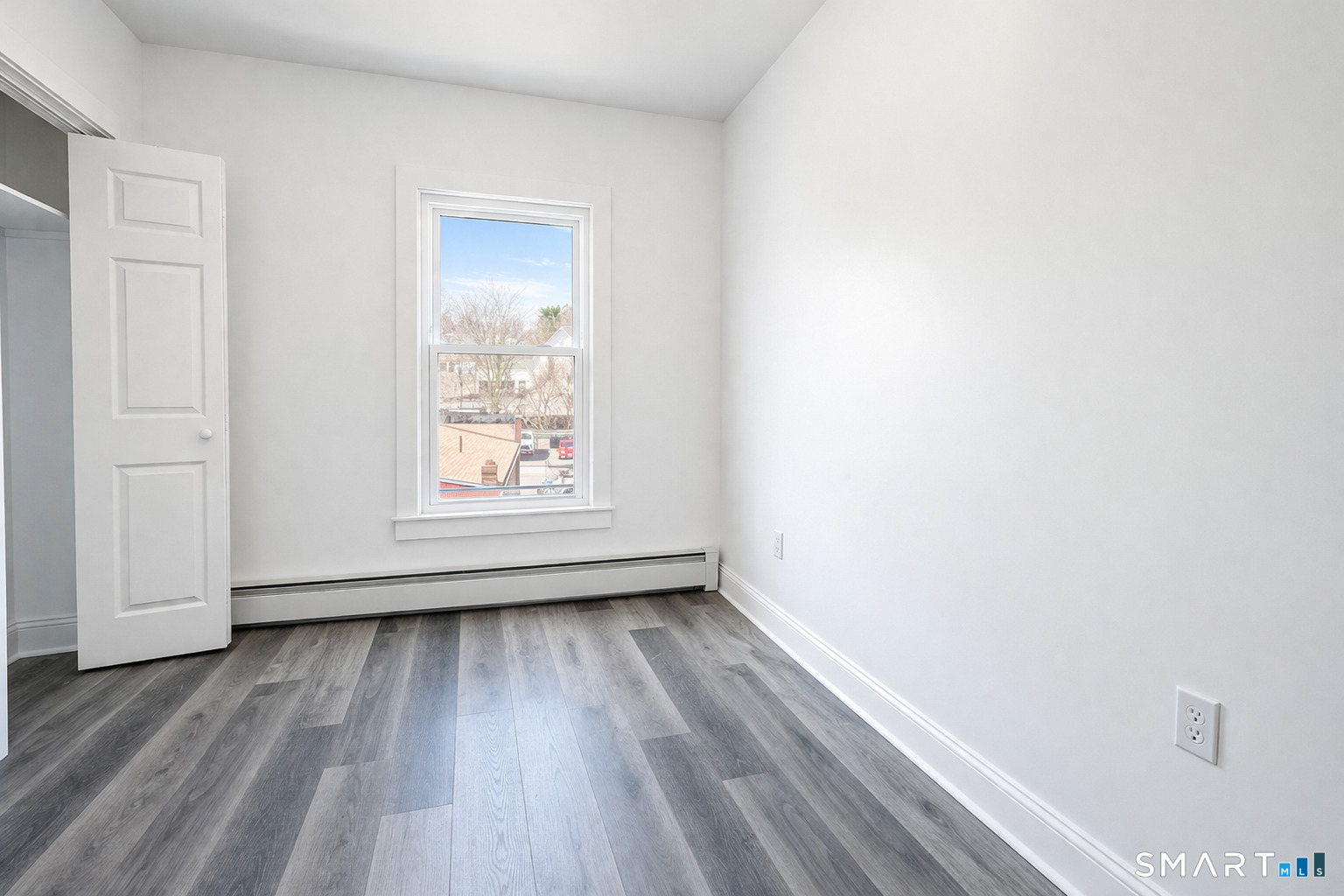 17 Sherman Avenue, Unit 3 Meriden, CT 06450 - Photo 14 of 19 a view of an empty room and wooden floor