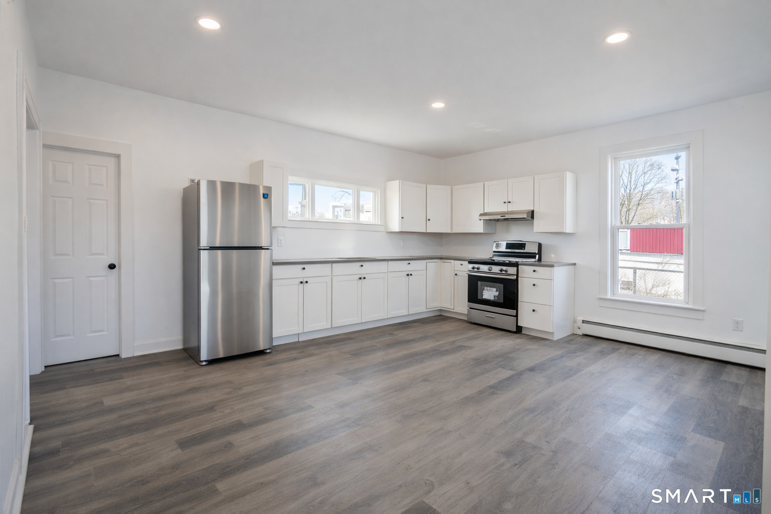 17 Sherman Avenue, Unit 3 Meriden, CT 06450 - Photo 4 of 19 a kitchen with stainless steel appliances granite countertop a refrigerator and a stove top oven