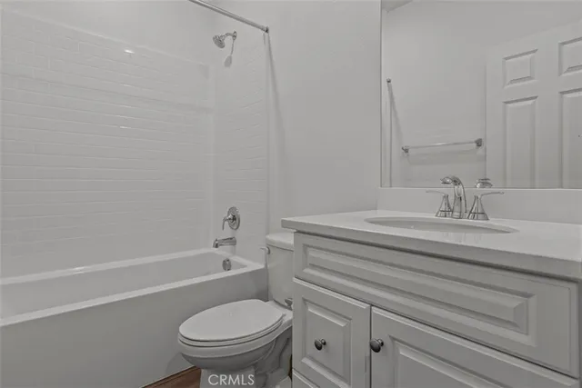 a bathroom with a sink a toilet and a bathtub