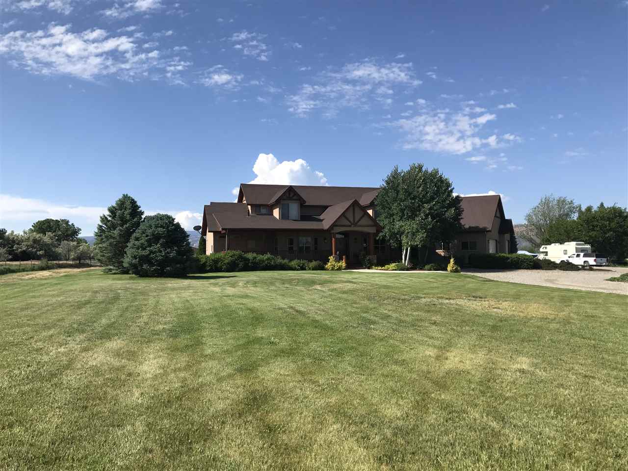 2325 I Road Grand Junction, CO 81505 - Photo 8 of 9 a tall yellow building in middle of a field