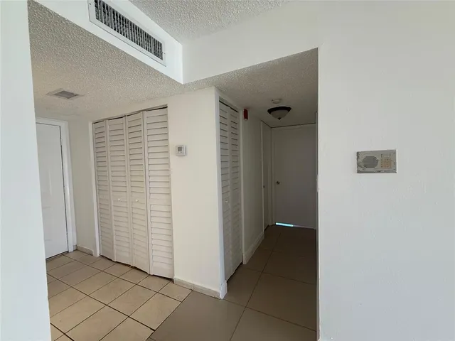 a view of empty room with windows