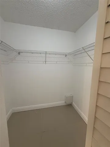 a bathroom with a sink toilet and mirror