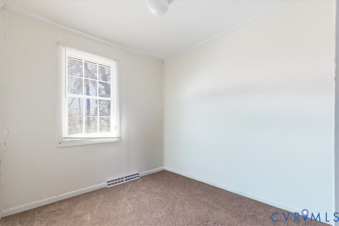 524 Clay Street Wakefield, VA 23888 - Photo 12 of 20 an empty room with a window
