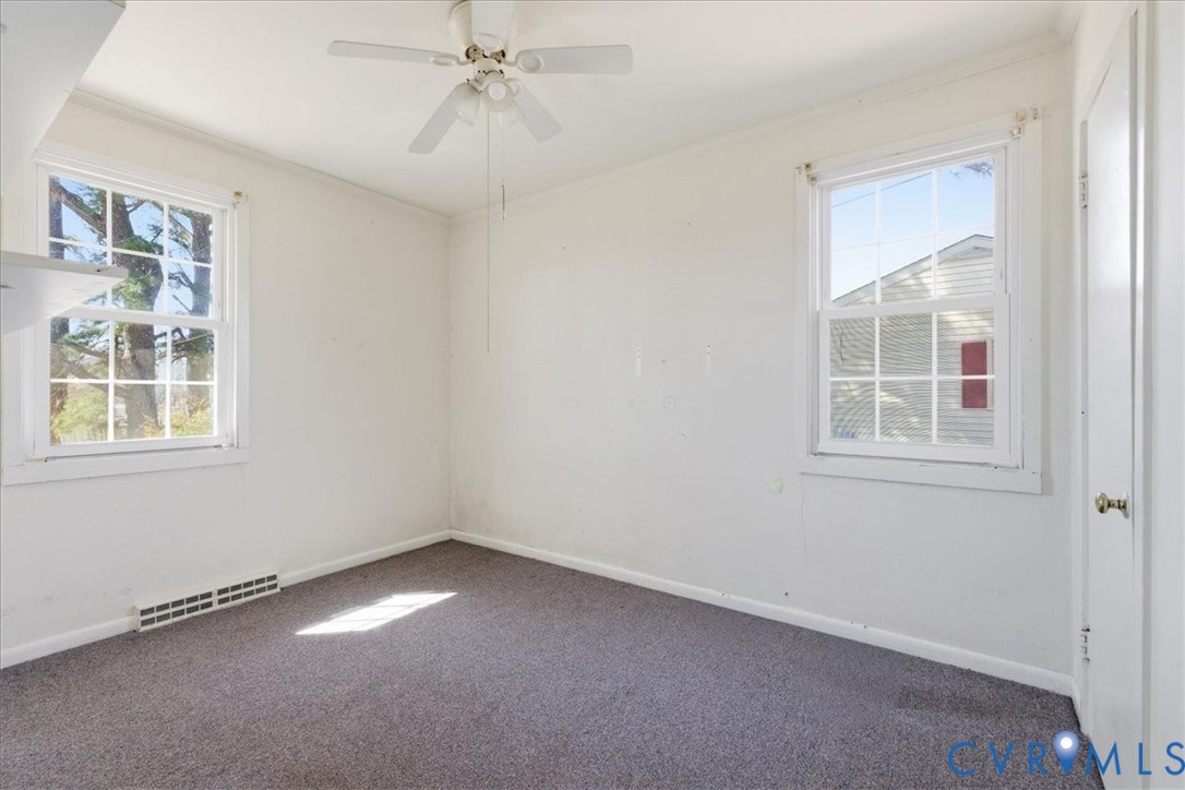 524 Clay Street Wakefield, VA 23888 - Photo 13 of 20 a view of an empty room with a window