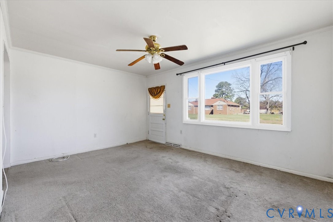 524 Clay Street Wakefield, VA 23888 - Photo 5 of 20 wooden floor in an empty room with a window