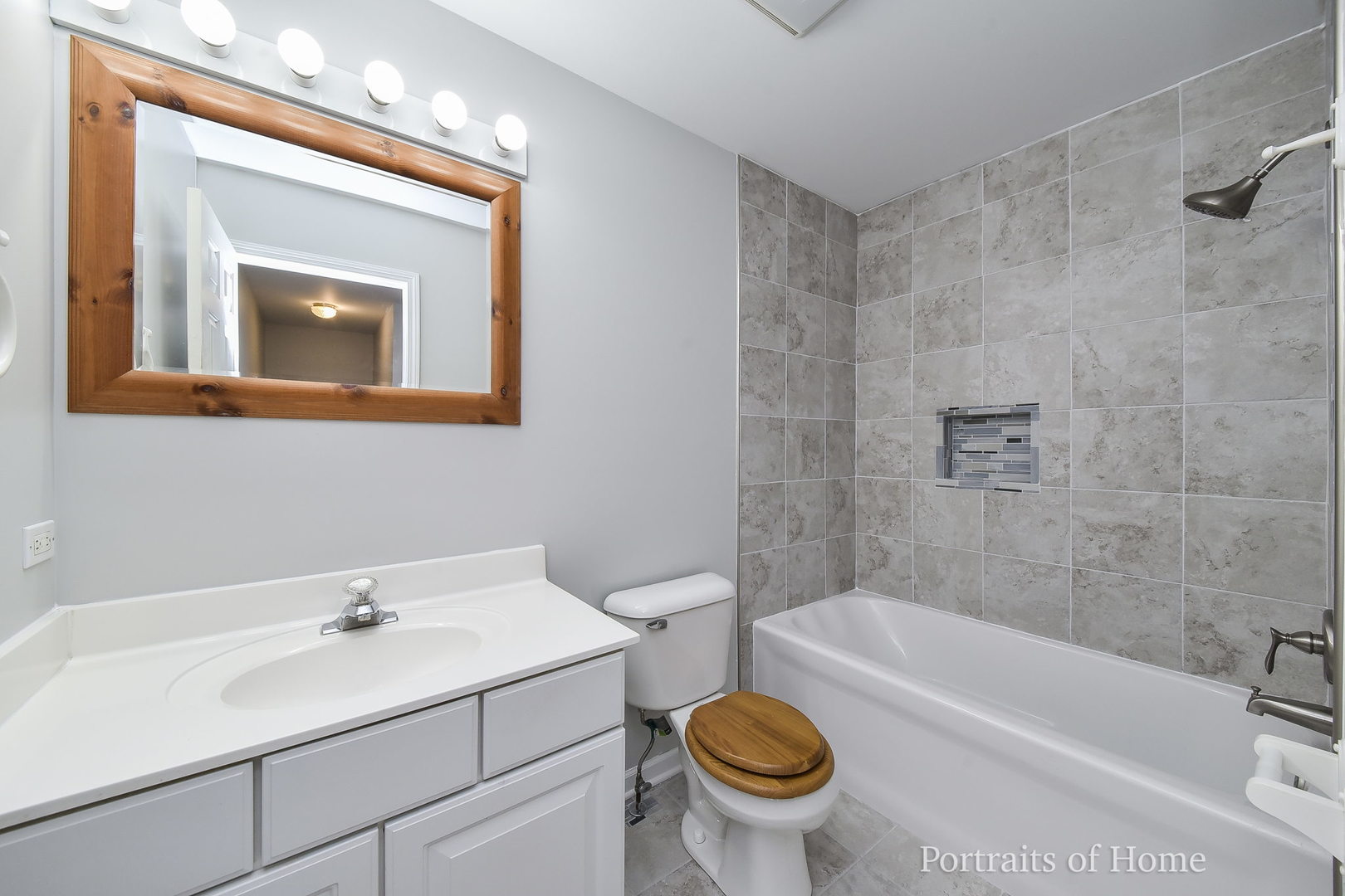 235 Rollin Road, Unit C Somonauk, IL 60552 - Photo 15 of 20 a bathroom with a sink and a bathtub