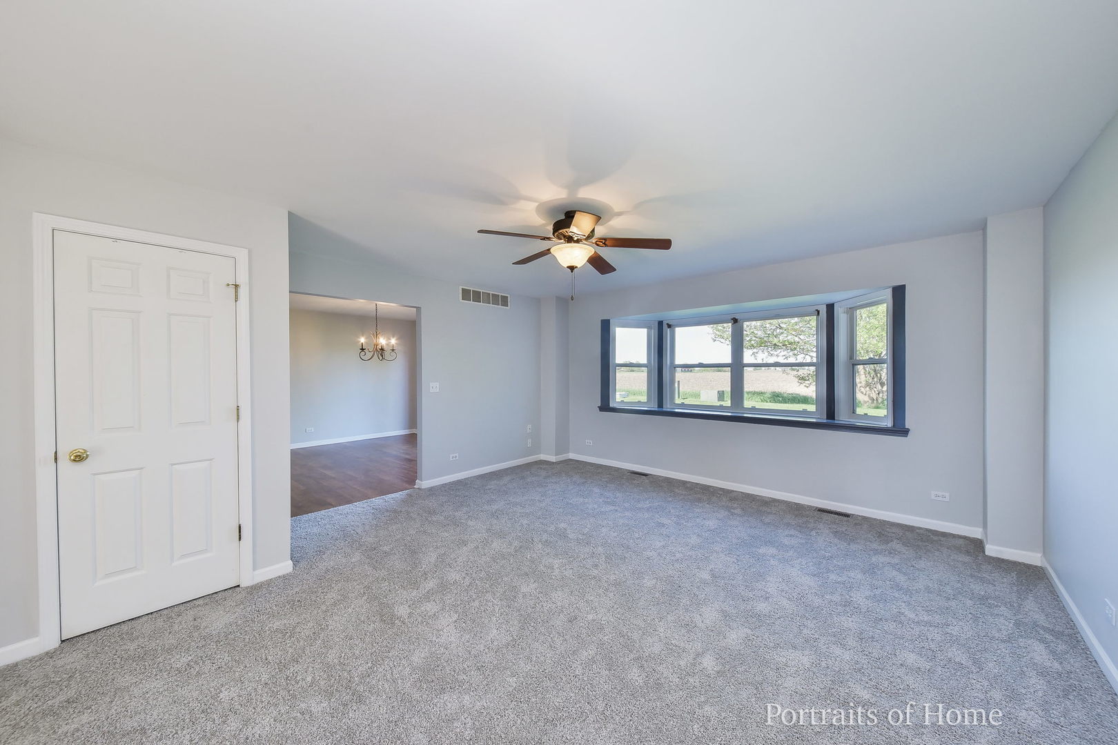 235 Rollin Road, Unit C Somonauk, IL 60552 - Photo 3 of 20 a view of an empty room with a window