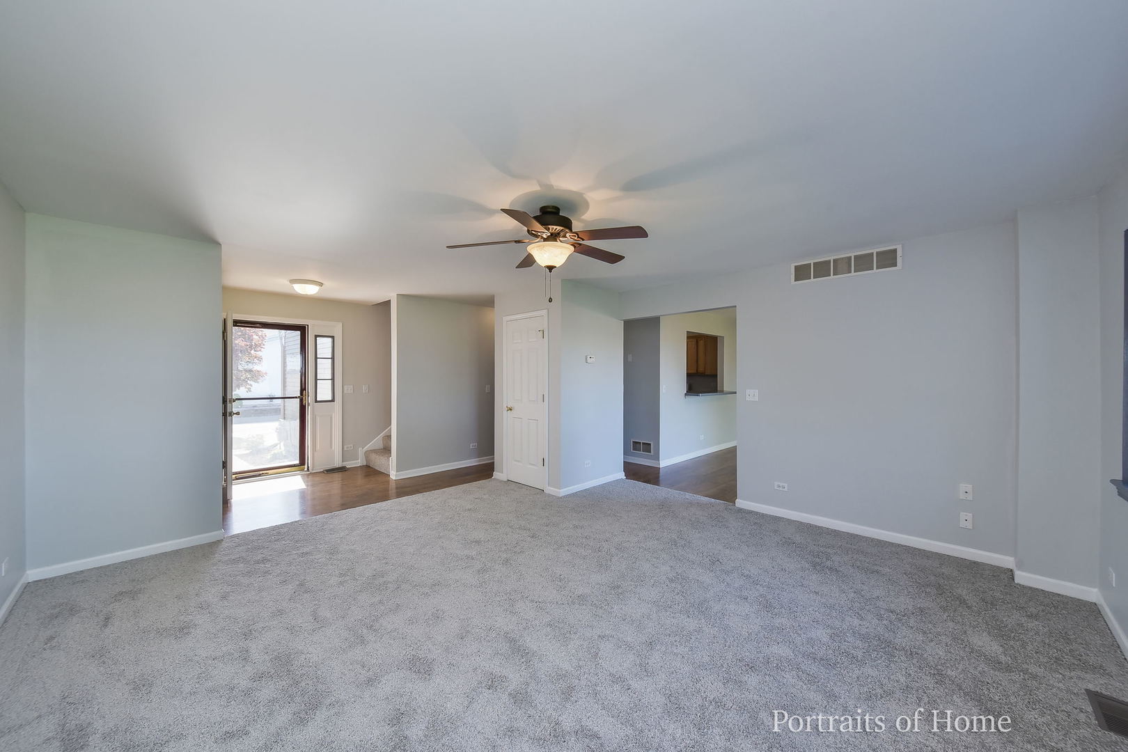 235 Rollin Road, Unit C Somonauk, IL 60552 - Photo 4 of 20 a view of an empty room with a window